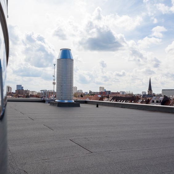 Black roof on a tall building